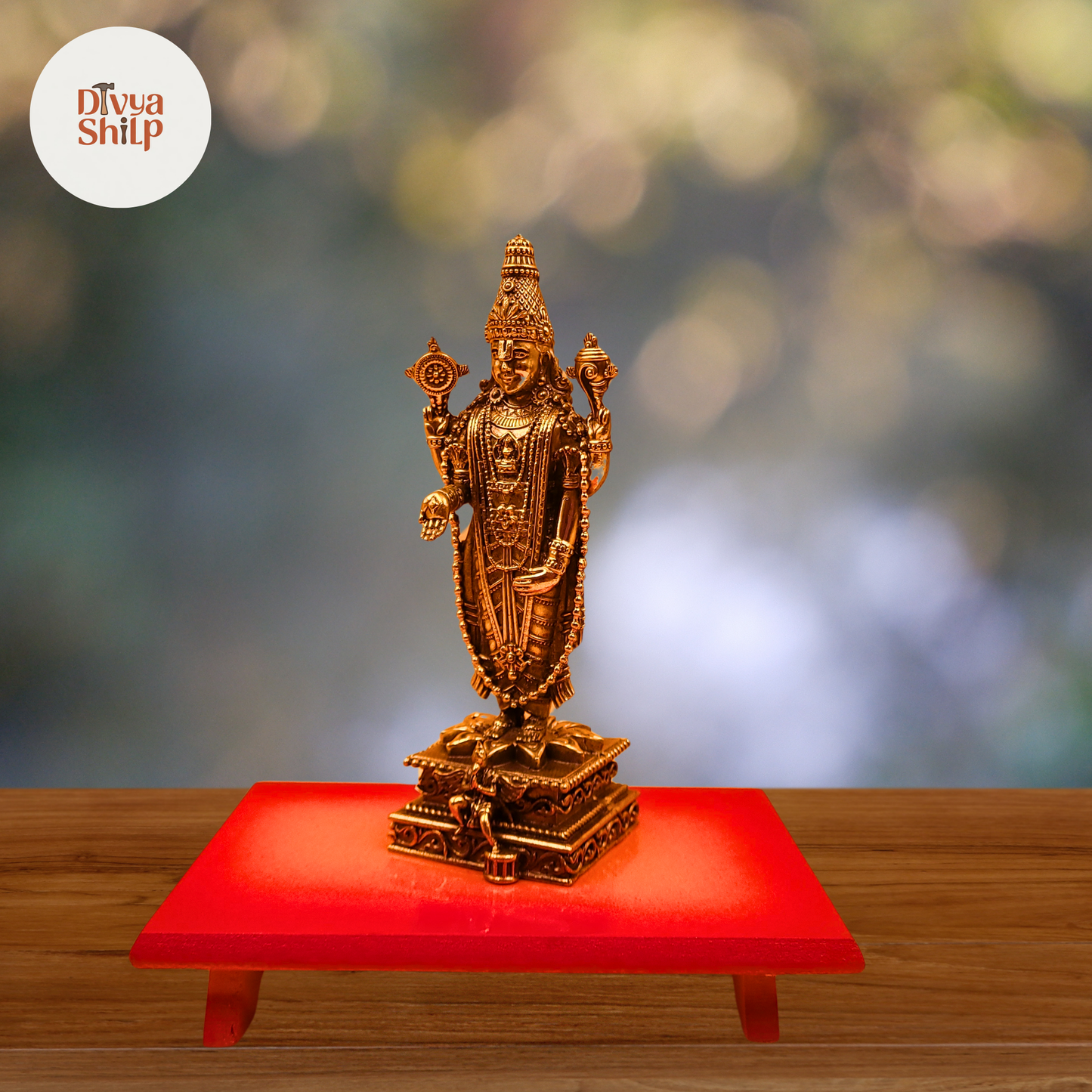 Tirupati Balaji brass idol with intricate temple-style carvings on a warm, softly lit background.